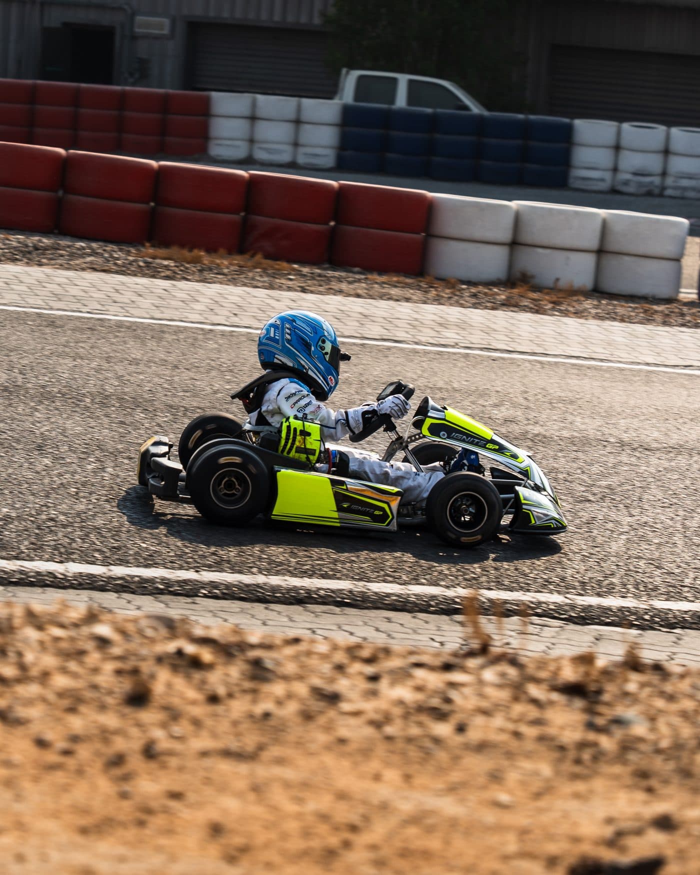 Bambino kart passing the barriers, seen from trackside